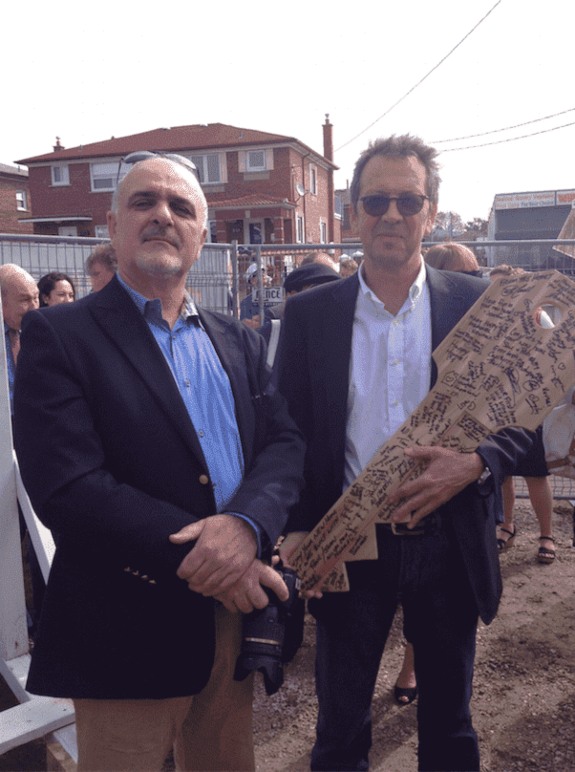 Two Men Posing for a Picture at Costa Family Move-in Day in Toronto